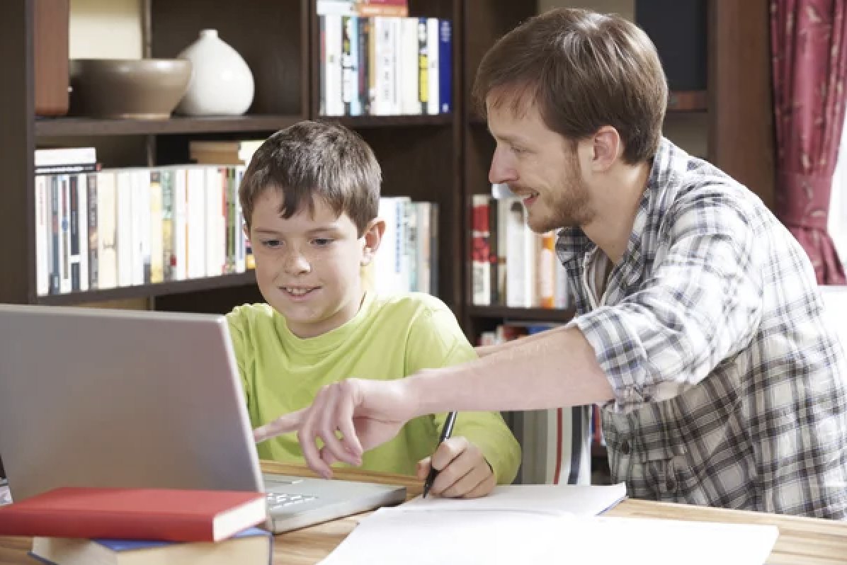 A tutor helping a student with schoolwork